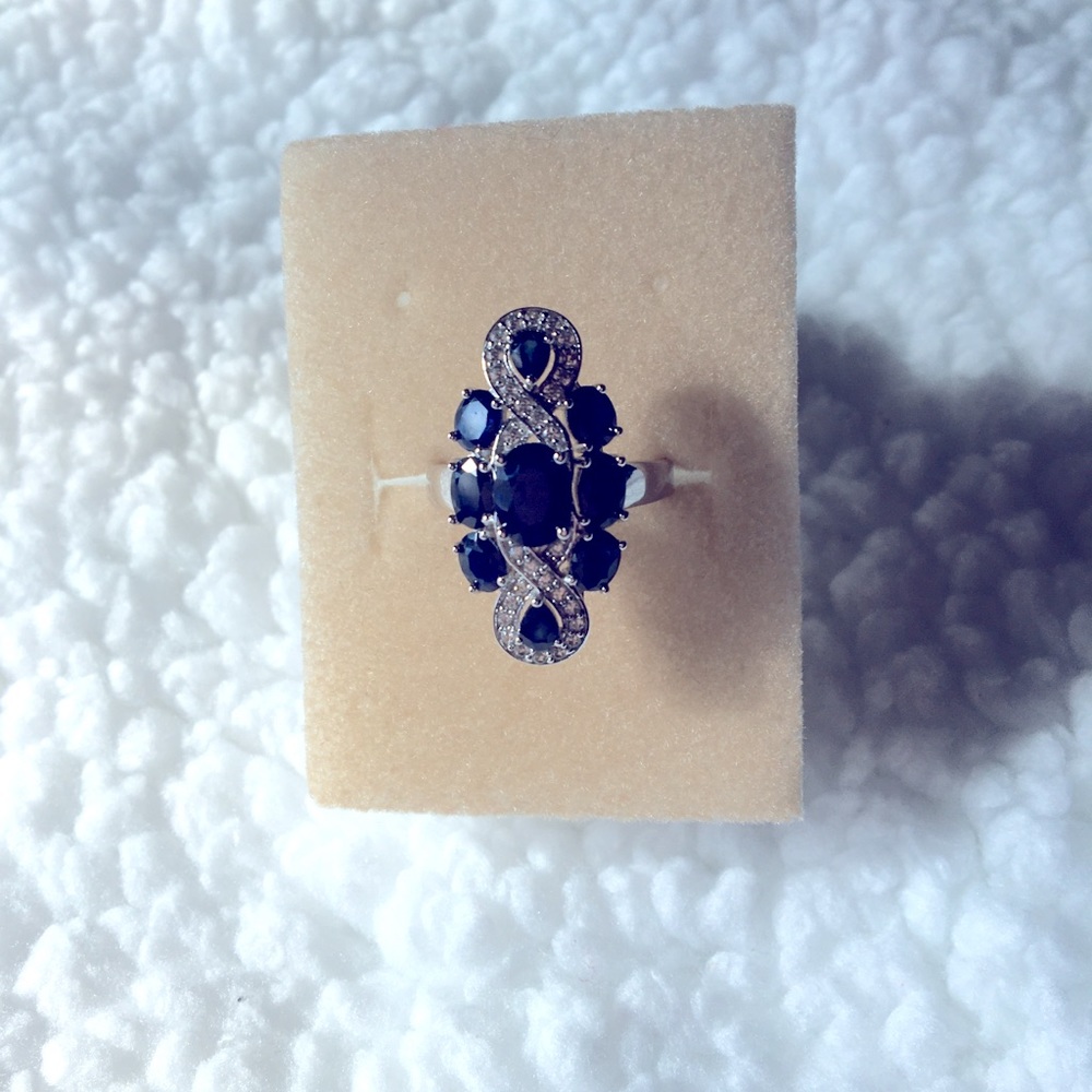 Natural blue sapphire ring. 4.17 ctw of ovals and pear shapes. Size 8. Rhodium.